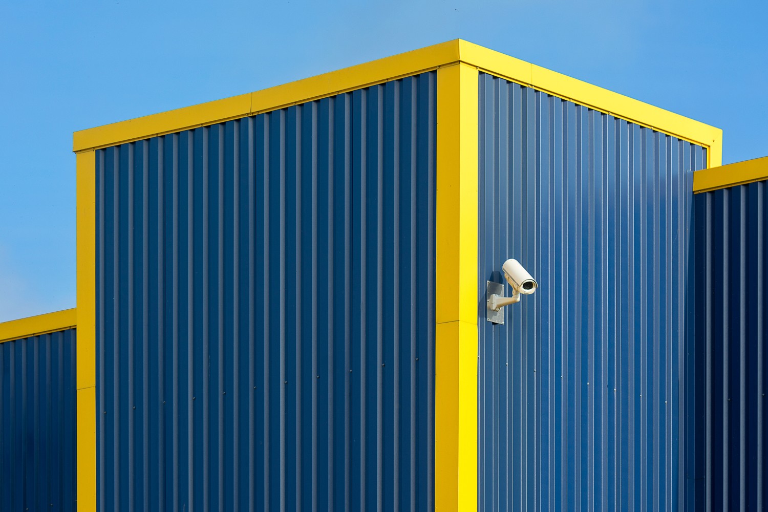 a-security-camera-on-a-metal-decking-wall