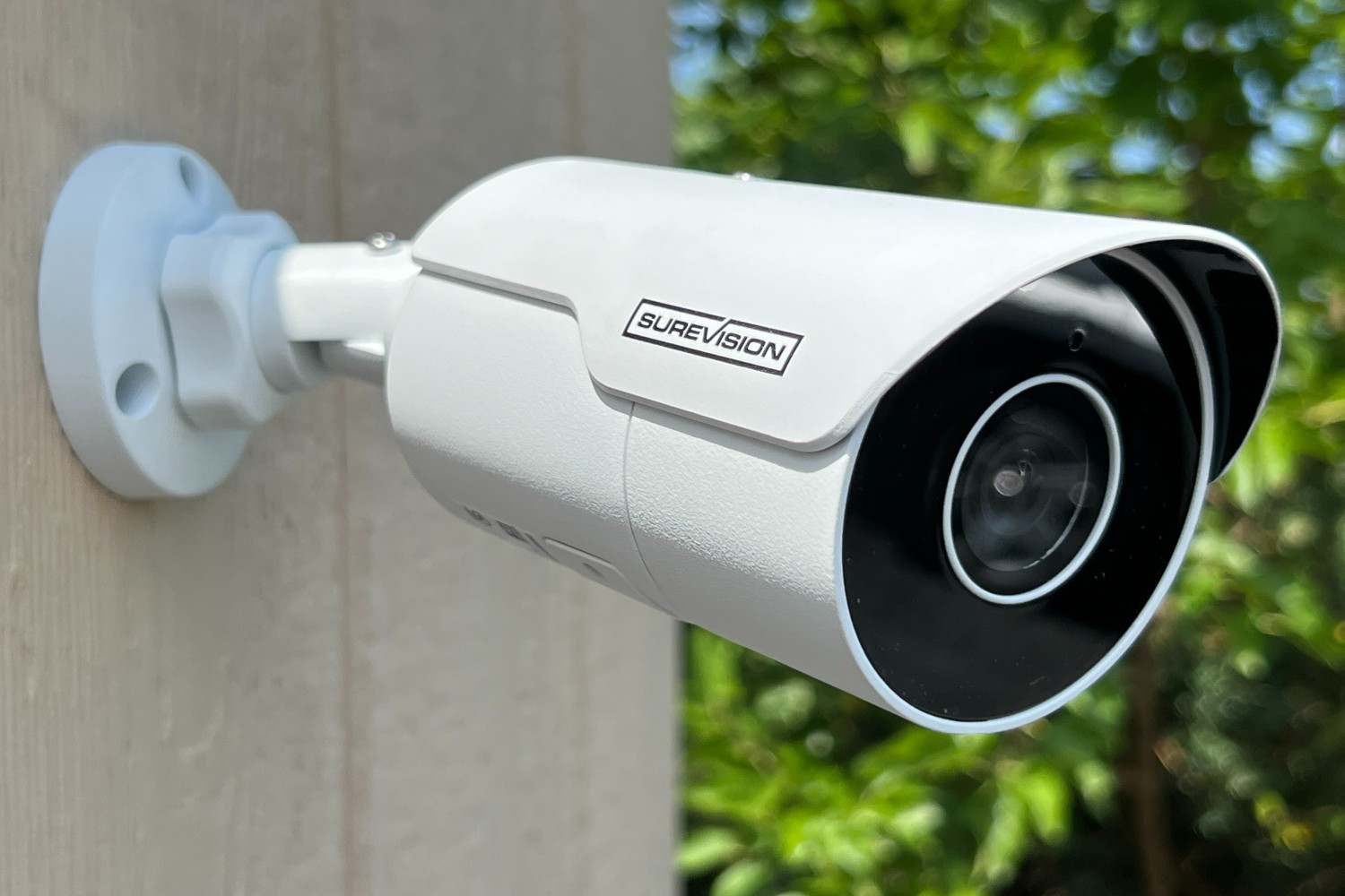 outdoor security camera mounted on wall