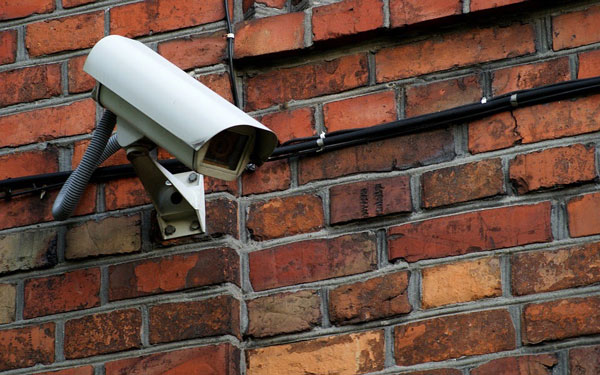 Security camera on brick wall