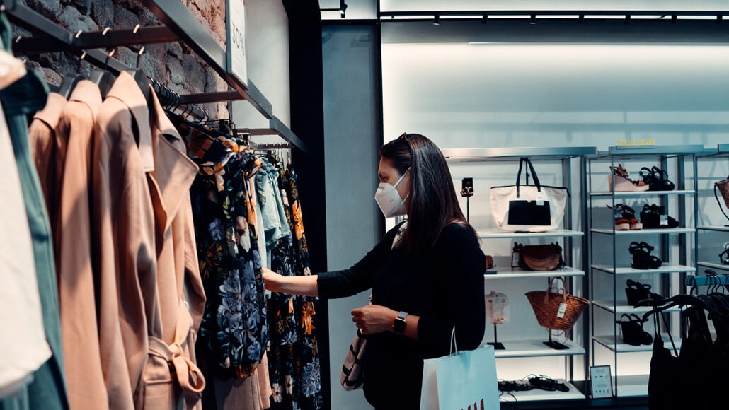 woman shopping at a clothing retail store